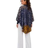 Cozy Cashmere Feel Travel Loop Wrap. This one-size-fits-all reversible loop wrap drapes over and accents any outfit, casual or dressy. It has a loop on both sides to make it truly reversible. Wear looped to stay in place or wear loosely as a shawl. It feels and looks like cashmere. A beautiful layering piece!

85% Poly, 15% Cotton.&nbsp;

Dry clean or hand wash cold with light colors, lay flat to dry, • iron on the lowest setting if needed, • do not bleach.