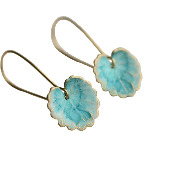 These leaf earrings are beautifully detailed and have been hand painted in a beautiful duck egg blue shade. They remind us of beautiful watercolour lily pads from a Monet painting.

The earrings measure just over an inch in length.