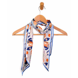 This colorful scarf has a bright white background with a turquoise blue blorder and a copper, bright navy, orange, green, red and lavender floral pattern. Wear it around your neck, use it as a hair tie or, it also is fun tied to your favorite bag!

Approximately 57" L x 5.25" W

100% Polyester