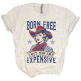 We are LOVING this t-shirt - it says it all!&nbsp; A blond western girl with a red hat and scarf is in the center of the tee with the words: "BORN FREE" above and "BUT NOW I'M EXPENSIVE" below.&nbsp; Hillarious....but true!! Printed on a super soft grey t-shirt, you'll love wearing it this summer!