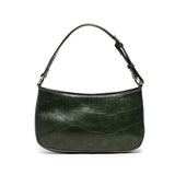 The sleek bottle green Erin Hobo will compliment your look for the office or your next night out. Fashioned in glossy croc embossed vegan leather, this sophisticated bag closes with a brass zipper to keep your belongings secure and is accented with burnished brass rings that open to allow you to change the shoulder straps. Two shoulder straps are included with this stylish Hobo, a short strap to carry close to the body or a long strap to carry as a shoulder bag or as a crossbody. Both straps are adjustable 