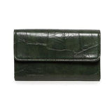 Our best-selling wallet has been updated this season in gorgeous, cruelty-free, embossed crocodile bottle green vegan leather in rich colors that coordinate perfectly with our collection of Croco bags. The Marnie wallet is a small sleek size but with all the functions of a full-size wallet. Featuring multiple credit card slots, billfold pockets and even a zipper coin pocket this wallet has space for everything you need in a slim, compact size. Perfect if you need that smaller wallet for your mini bag!
Produ
