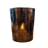 This beautiful marbled bronze candle holder has etched leaves scattered all around it. A beautiful piece to stick in with your fall decor, it easily fits a small candle or a votive and will create a gorgeous glow in your home!

Candle not included

Glass

Approximately 5" H x 4" Dia&nbsp;