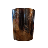 This beautiful marbled bronze candle holder has etched leaves scattered all around it. A beautiful piece to stick in with your fall decor, it easily fits a small candle or a votive and will create a gorgeous glow in your home!

Candle not included

Glass

Approximately 5" H x 4" Dia&nbsp;