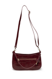 The sleek burgundy Erin Hobo will compliment your look for the office or your next night out. Fashioned in glossy croc embossed vegan leather, this sophisticated bag closes with a brass zipper to keep your belongings secure and is accented with burnished brass rings that open to allow you to change the shoulder straps. Two shoulder straps are included with this stylish Hobo, a short strap to carry close to the body or a long strap to carry as a shoulder bag or as a crossbody. Both straps are adjustable and 