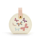 A beautiful gift for yourself or a friend, this traveling jewelry case is cream with a pink strap closure and six beautiful butterflies on the front. Inside there is room for your jewelry for a short weekend or a couple of weeks!

Foam, metal, paper, polyester fiber, polyurethane

2.5" h x 4.5" w x 4.5" d