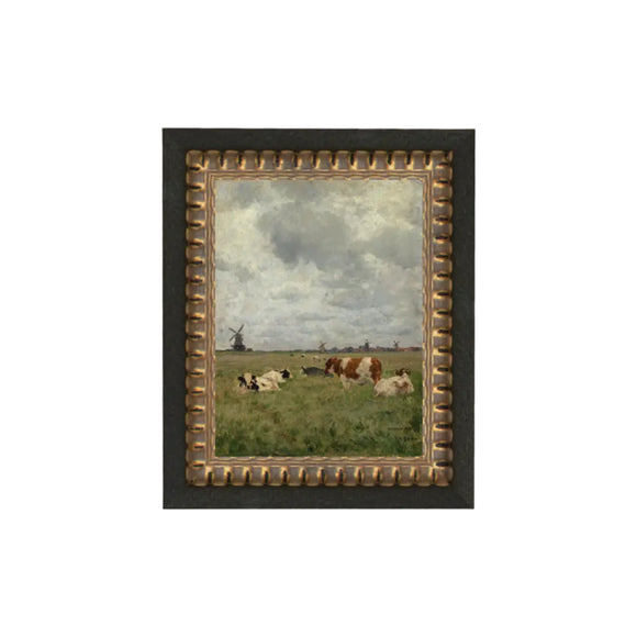What a calm & serene scene - cows in the pasture with windmills in the background with a beautiful cloud-filled sky! We know that you'll find lots of places to put this little artwork! Printed on premium canvas fabric for a lasting, textured finish and has a handcrafted black frame with gold dots that adds a classic charm.  Comes with a paper backing and hanging hardware for easy installation.

Made in the USA: Proudly crafted with quality and care. 

Care Instructions: Keep canvas dry to