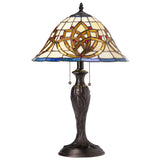 Add Celtic charm to your home with this beautiful 21.5-Inch Celtic Blooming Flower Stained Glass Table Lamp! This exquisite accent fixture masterfully pairs a slender candlestick frame with heritage glasswork to bring a warm presence to your home. The stunning dome shade showcases an intricate blooming flower design that traditionally symbolizes interconnectedness, purity, and renewal. Meticulously crafted using traditional stained glass techniques, it weaves together a vibrant, inviting palette of rich cre