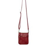 This chili colored compact phone bag is designed for everyday convenience and hands-free style. This slim crossbody is made from softly tumbled vegan leather with a sleek silhouette, adjustable crossbody strap and a secure zip closure. The Lia features a front zip pocket and a back slide pocket to keep your phone, cards, keys and small essentials neatly organized and easy to access. This crossbody bag is perfect for travel, shopping, concerts or daily errands.
Product Details
Dimensions: 7.5 in. H x 6.25 in