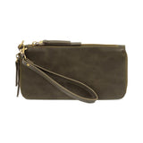 Cool, stylish, and organized, too! This wallet has it all! 12 credit card pockets, 2 change pockets and 2 billfold pockets all wrapped in a juniper green colored vegan leather, lined with rugged washed canvas, and accented with our new Logo zipper pull. The removable strap lets you carry it as a compact wristlet, too!


Dimensions: 7.75 in. W x 4 in. H x .5 in. D
Full Zip Around Closure
Exterior Zip Pocket on Spine
Removable Wristlet Strap
12 Credit Card Pockets
2 Billfold Pockets
Interior Zipper
Coin Pocke