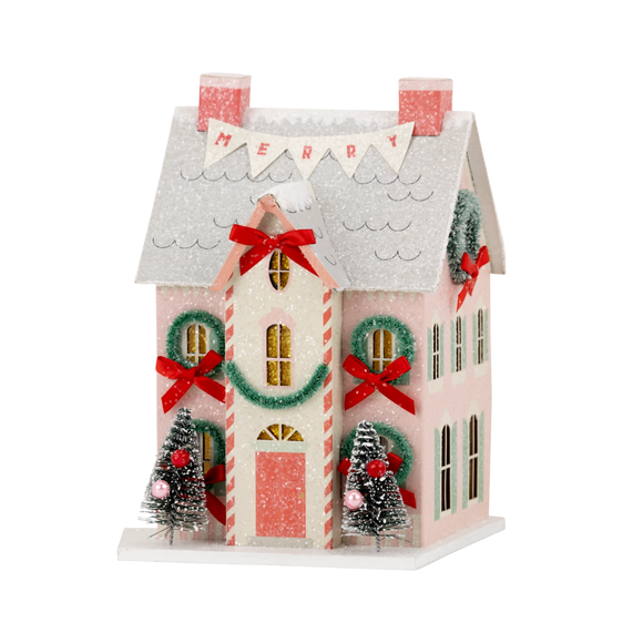 Add some sparkle to your holiday decor with our Christmas Village Merry House. Made of heavyweight paper with glitter accents, this charming village house will bring holiday cheer to any room. Perfect for creating a festive atmosphere and capturing the magic of the season.

House is 4.5