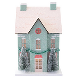 Create a cozy Christmas village in a snap with this festive house, decorated and ready for Santa's arrival. This Christmas house is built from sturdy cardboard and features darling glitter and snowy accents that pair perfectly with our church and patisserie, creating a stunning holiday tablescape for your Christmas party this year!&nbsp;

House is 5.5" wide x 5.75" deep x 8.5" tall&nbsp;

Includes battery-powered light inside.&nbsp;

Requires 2 AAA batteries. Please keep out of reach of small children