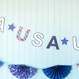 Get ready to celebrate in style with our Floral USA Banner! This patriotic banner features beautiful floral prints and is perfect for any party. Let your patriotism shine and add a touch of elegance to your next celebration. Order now for a festive and fun addition to your décor!

&nbsp;• USA paper banner

• Pieces are 4.5 inches tall

• Banner is approximately 5 ft