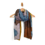 A beautiful scarf in rich coffee browns, blues and chartreuse to wrap yourself in this season!

190" L x 70" W

100% Polyester
