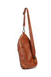 Stay organized on the go with this versatile medium-sized cognac sling bag featuring a modern silhouette and practical storage. Designed to blend fashion with functionality, it features spacious zip compartments, lightweight construction, and an ergonomic crossbody fit with an adjustable strap. Roomy enough to stow a large wallet, cell phone, even a slim water bottle. The Jas is ideal for city walks, sightseeing, and weekend adventures.
Product Details
Dimensions: 511 in. H x 6.25 in. W x 3 in. D
Removable 