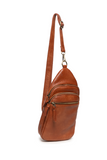 Stay organized on the go with this versatile medium-sized cognac sling bag featuring a modern silhouette and practical storage. Designed to blend fashion with functionality, it features spacious zip compartments, lightweight construction, and an ergonomic crossbody fit with an adjustable strap. Roomy enough to stow a large wallet, cell phone, even a slim water bottle. The Jas is ideal for city walks, sightseeing, and weekend adventures.
Product Details
Dimensions: 511 in. H x 6.25 in. W x 3 in. D
Removable 