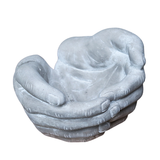 These unique and artistic hand-shaped concrete planters feature a realistic sculptural design resembling cupped hands holding plants. The sturdy cement material gives them an industrial yet organic aesthetic, making them a great addition to gardens, patios, or indoor spaces.

7.5"W x 7.8"L x3"H

Plant and Candle not included