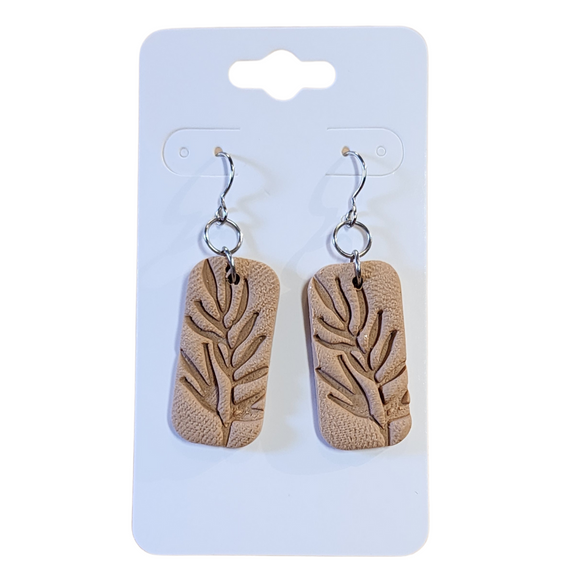 You will love these lightweight, trendy polymer clay earrings in a fun leaf embossed rectangle earrings in a beautiful tan color. This pair of clay earrings is coated with a resin layer to give them a pretty shine and finished look! The earring hooks are comfortable and easy to wear and made of high-quality, strong/durable stainless steel, which is hypoallergenic and nickel-free. * 

This versatile earring design would accompany any outfit, from casual to dressed up! 

Handcrafted in Texas, USA&nb