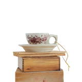 Bring a touch of whimsical elegance this Christmas with the Stoneware Teacup Ornament with Botanical Motif in cream and burgundy. Thoughtfully handcrafted with artful botanical details, a natural glaze, and texture variations.

1.5" H x 3.5" W (includes handle) x 3" D