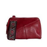 Retro styling crafted in antiqued vegan leather gives this rich crimson red. clutch a vintage vibe. The removable woven wrist strap is the finishing touch on this stylish bag so you can wear it as a wristlet, a clutch, or a crossbody with the included removable shoulder strap!





6.75"H x 9.75"W x 2.25"D

Removable and adjustable crossbody strap 22"-26"

Removable long wristlet strap 7.5" long

Zippered top closure

Interior zippered pocket

Exterior back zipper pocket

Brass plated hardware

100% vegan l