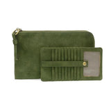 Karina combines sleek styling with uber organization in a beautiful faux suede dark emerald leather. The ultimate in versatility, this bag can be worn as a crossbody, carried as a clutch or as a wristlet. The included bonus wallet with credit card slots, ID windows, zippered change pocket and billfold will keep your organized on the go and can be carried separately.


Product Details
Main Bag
Dimensions: 9.75 in. W x 6 in. H x 1 in. D
Zippered Top Closure
Exterior Open Pocket
Interior Zipper Pocket
Detachab