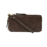 Cool, stylish, and organized, too! This wallet has it all! 12 credit card pockets, 2 change pockets and 2 billfold pockets all wrapped in a dark oak&nbsp;colored vegan leather, lined with rugged washed canvas, and accented with our new Logo zipper pull. The removable strap lets you carry it as a compact wristlet, too!


Dimensions: 7.75 in. W x 4 in. H x .5 in. D
Full Zip Around Closure
Exterior Zip Pocket on Spine
Removable Wristlet Strap
12 Credit Card Pockets
2 Billfold Pockets
Interior Zipper
Coin Pocke