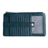This slim and sleek wallet has nine credit card pockets, each with a snap tab for security and brass-plated hardware. It also has an ID window, zippered change pocket, and zippered billfold pocket in dark indigo vegan leather.


DIMENSIONS: 3.75 IN. H X 7.25 IN. W X .25 IN. D&nbsp;


100% Vegan leather (polyurethane)