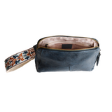 Retro styling crafted in antiqued vegan leather gives this dark indigo clutch a vintage vibe. The removable woven wrist strap is the finishing touch on this stylish bag so you can wear it as a wristlet, a clutch, or a crossbody with the included removable shoulder strap!





6.75"H x 9.75"W x 2.25"D

Removable and adjustable crossbody strap 22"-26"

Removable long wristlet strap 7.5" long

Zippered top closure

Interior zippered pocket

Exterior back zipper pocket

Brass plated hardware

100% vegan leather