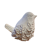 We are loving the embossed floral design on the one side of this distressed white bird that is looking straight!

&nbsp;Polyresin, Stone Powder

Approximately 3.5" H x 2.75" W x 3.75" D