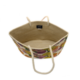 How does your garden grow? Very well with this beautiful tote embellished with a delicate pattern of chrysanthemums in fresh, bright, summery colors. The floral pattern has been hand painted and accented by dark green shoulder straps to give this all-natural jute fiber tote an earthy vibe.

Dimensions: 12 in. H x 19 in. W x 8 in. D
Open topShoulder straps: 10 in. drop
100% Natural Jute with hand painted flower pattern
Unlined