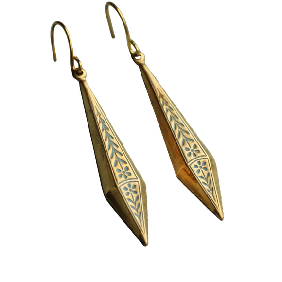 These beautiful earrings feature a filigree floral design in solid brass. The inset floral pattern is picked out by a dusty cornflower blue paint and is designed to hang just below the earlobe. 

The earrings measure just over an inch and a half in length and have solid brass earwires.