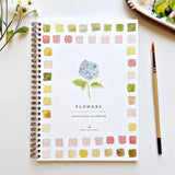 We are obsessed with this Flower Watercolor Workbook! It includes 12 floral illustrations with an example of the finished painting, step-by-step instructions, and a lightly illustrated sketch for you to paint. It's just like a coloring book, but with watercolor! Enjoy this peaceful painting hobby on your own, with children, or with friends. Makes a wonderful gift and is perfect for artists of any age.

12 beginner-friendly illustrations on thick 120lb watercolor paper

Lay-flat pages with spiral binding for