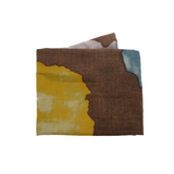 A beautiful scarf in rich coffee browns, blues and chartreuse to wrap yourself in this season!

190" L x 70" W

100% Polyester