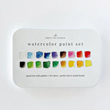 Everything you need to start painting, gathered in one compact tin. This set pairs beautifully with the Emily Lex Studio watercolor workbooks and paintable notecards. The 18 colors look beautiful straight from the palette and also mix wonderfully into your own colors.

The fold-open tin holds your paints, mixing trays, and a petite size 6 round brush. Lightweight and travel-ready, it tucks easily into a bag so you can paint wherever the mood strikes.

Details: - 18 watercolors in a range of hues for easy mi