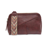 Retro styling crafted in antiqued vegan leather gives this beauitful currant colored clutch a vintage vibe. The removable woven wrist strap is the finishing touch on this stylish bag, so you can wear as a wristlet, a clutch, or even a crossbody with the included removable shoulder strap!





6.75"H x 9.75"W x 2.25"D

Removable and adjustable crossbody strap 22"-26"

Removable long wristlet strap 7.5" long

Zippered top closure

Interior zippered pocket

Exterior back zipper pocket

Brass plated hardware

1