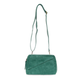 Retro styling crafted in antiqued vegan leather gives this fun jungle green-colored clutch a vintage vibe. The removable woven wrist strap is the finishing touch on this stylish bag so you can wear it as a wristlet, a clutch, or a crossbody with the included removable shoulder strap!





6.75"H x 9.75"W x 2.25"D

Removable and adjustable crossbody strap 22"-26"

Removable long wristlet strap 7.5" long

Zippered top closure

Interior zippered pocket

Exterior back zipper pocket

Brass plated hardware

100% 