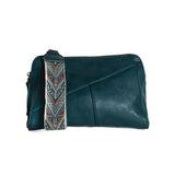 Retro styling crafted in antiqued vegan leather gives this rich classic tea. clutch a vintage vibe. The removable woven wrist strap is the finishing touch on this stylish bag so you can wear it as a wristlet, a clutch, or a crossbody with the included removable shoulder strap!





6.75"H x 9.75"W x 2.25"D

Removable and adjustable crossbody strap 22"-26"

Removable long wristlet strap 7.5" long

Zippered top closure

Interior zippered pocket

Exterior back zipper pocket

Brass plated hardware

100% vegan l