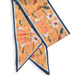 This orange scarf has flowers and butterflies in creams, reds, yellows and turquoises with a dark turquoise blue border.

Approximately 57" L x 5.25" W

100% Polyester