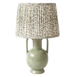 This stunning sage green jug lamp will add color to any space, featuring a pleated white shade with intricate sage green leaves. It's the perfect blend of elegance and charm!

Overall 19.25" H, Shade 8.75" H x 12" Dia; Base 13" H x 5.25" W

Ceramic, Fabric, Iron