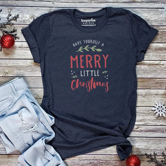 Our newest Christmas T-shirt is a heathered navy color with the words 