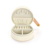 A beautiful gift for yourself or a friend, this traveling jewelry case is cream with a pink strap closure and six beautiful butterflies on the front. Inside there is room for your jewelry for a short weekend or a couple of weeks!

Foam, metal, paper, polyester fiber, polyurethane

2.5" h x 4.5" w x 4.5" d