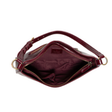 The sleek burgundy Erin Hobo will compliment your look for the office or your next night out. Fashioned in glossy croc embossed vegan leather, this sophisticated bag closes with a brass zipper to keep your belongings secure and is accented with burnished brass rings that open to allow you to change the shoulder straps. Two shoulder straps are included with this stylish Hobo, a short strap to carry close to the body or a long strap to carry as a shoulder bag or as a crossbody. Both straps are adjustable and 