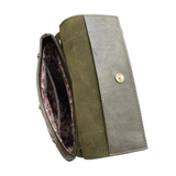With a slim, streamlined look, this vegan leather crossbody, in a beautiful backwoods green, features a top flap with magnetic snap closure and an adjustable shoulder strap so you can carry it as a crossbody or a shoulder bag. With two convenient slip pockets, one under the flap and one on the back you can keep your phone and keys in easy reach.


Dimensions: 9.5 in. H x 8 in. W x 2.75 in. D
Magnetic snap closure
Adjustable shoulder strap: 14 in. - 27.5 in. drop
Brass plated hardware
100% Vegan leather (pol