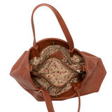 Accented by deep pleats this slouchy satchel bag crafted in softly tumbled vegan leather gives a modern yet feminine vibe to your look. Stay organized with three interior compartments including one zipper and two magnetic snap closures, with space for your wallet, phone, cosmetics and more. Featuring both top handles and a removable shoulder strap, this versatile crossbody bag will accent all your looks from casual to dressy.
Product Details
Dimensions: 8.25 in. H x 10.5 in. W x 4 in. D
3 Interior compartme