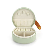 A beautiful gift for yourself or a friend, this traveling jewelry case is green with a brown strap closure. Inside there is room for your jewelry for a short weekend or a couple of weeks!

Foam, metal, paper, polyester fiber, polyurethane

2.5" h x 4.5" w x 4.5" d