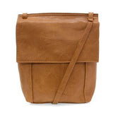 With a slim, streamlined look, this vegan leather crossbody in a beautiful chestnut color features a top flap with magnetic snap closure and an adjustable shoulder strap so you can carry it as a crossbody or a shoulder bag. With two convenient slip pockets, one under the flap and one on the back you can keep your phone and keys in easy reach.


Dimensions: 9.5 in. H x 8 in. W x 2.75 in. D
Magnetic snap closure
Adjustable shoulder strap: 14 in. - 27.5 in. drop
Brass plated hardware
100% Vegan leather (polyur