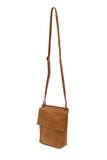 With a slim, streamlined look, this vegan leather crossbody in a beautiful chestnut color features a top flap with magnetic snap closure and an adjustable shoulder strap so you can carry it as a crossbody or a shoulder bag. With two convenient slip pockets, one under the flap and one on the back you can keep your phone and keys in easy reach.


Dimensions: 9.5 in. H x 8 in. W x 2.75 in. D
Magnetic snap closure
Adjustable shoulder strap: 14 in. - 27.5 in. drop
Brass plated hardware
100% Vegan leather (polyur