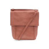 With a slim, streamlined look, this vegan leather crossbody in a beautiful clay pink color features a top flap with magnetic snap closure and an adjustable shoulder strap so you can carry it as a crossbody or a shoulder bag. With two convenient slip pockets, one under the flap and one on the back you can keep your phone and keys in easy reach.


Dimensions: 9.5 in. H x 8 in. W x 2.75 in. D
Magnetic snap closure
Adjustable shoulder strap: 14 in. - 27.5 in. drop
Brass plated hardware
100% Vegan leather (polyu