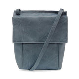 With a slim, streamlined look, this vegan leather crossbody in a beautiful chambray blue color features a top flap with magnetic snap closure and an adjustable shoulder strap so you can carry it as a crossbody or a shoulder bag. With two convenient slip pockets, one under the flap and one on the back you can keep your phone and keys in easy reach.


Dimensions: 9.5 in. H x 8 in. W x 2.75 in. D
Magnetic snap closure
Adjustable shoulder strap: 14 in. - 27.5 in. drop
Brass plated hardware
100% Vegan leather (p