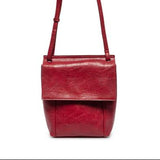 With a slim, streamlined look, this vegan leather crossbody, in a beautiful cranberry color, features a top flap with magnetic snap closure and an adjustable shoulder strap so you can carry it as a crossbody or a shoulder bag. With two convenient slip pockets, one under the flap and one on the back you can keep your phone and keys in easy reach.


Dimensions: 9.5 in. H x 8 in. W x 2.75 in. D
Magnetic snap closure
Adjustable shoulder strap: 14 in. - 27.5 in. drop
Brass plated hardware
100% Vegan leather (pol